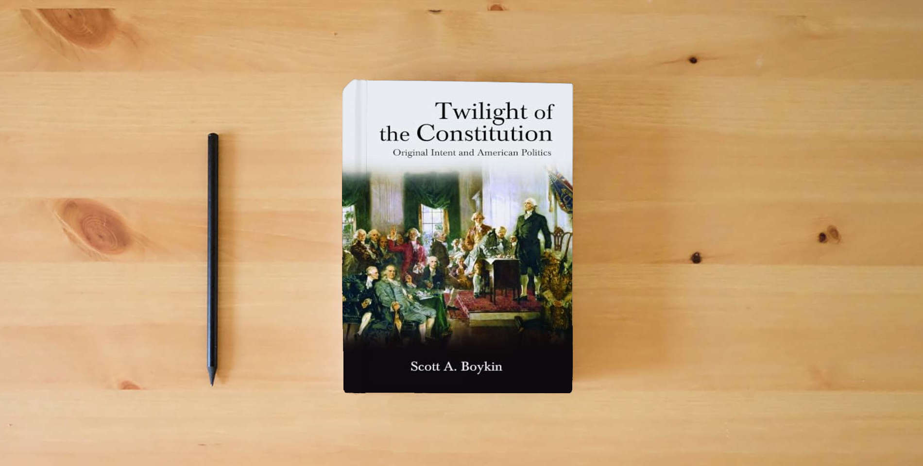 The book Twilight of the Constitution: Original Intent and American Politics (SUNY series in American Constitutionalism) is on the table