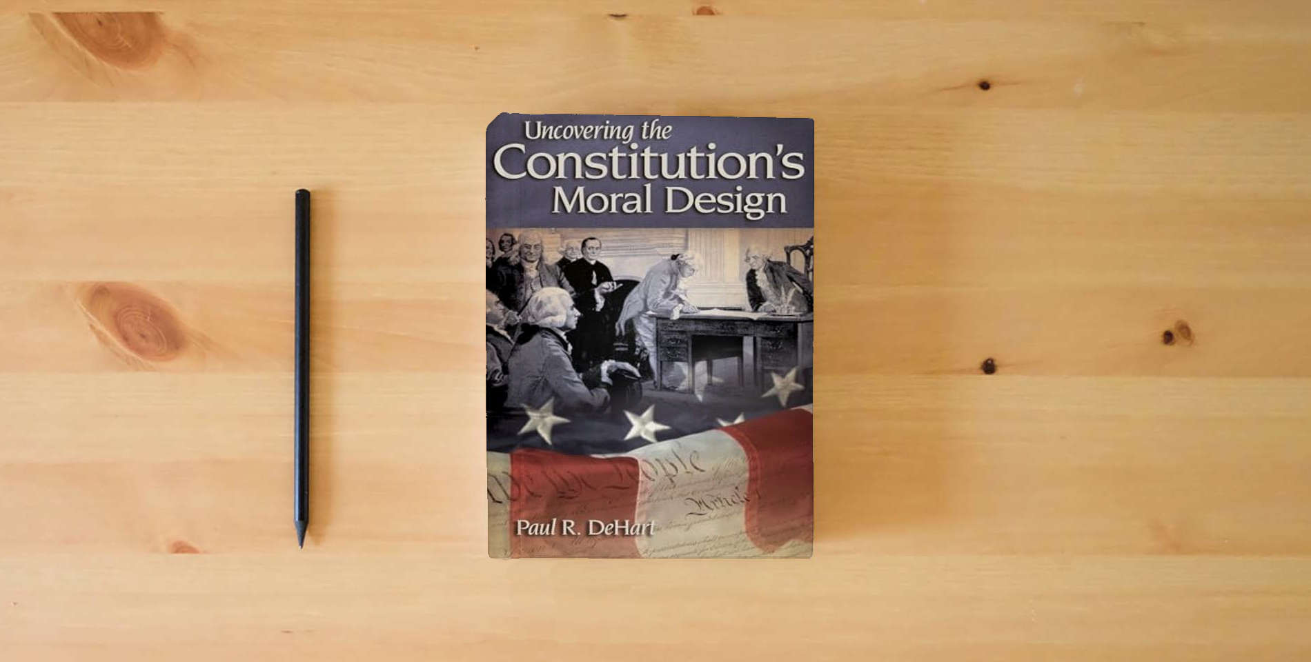 The book Uncovering the Constitution's Moral Design is on the table
