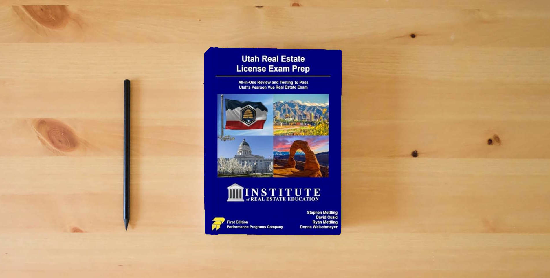 The book Utah Real Estate License Exam Prep - Institute of Real Estate Education Edition is on the table