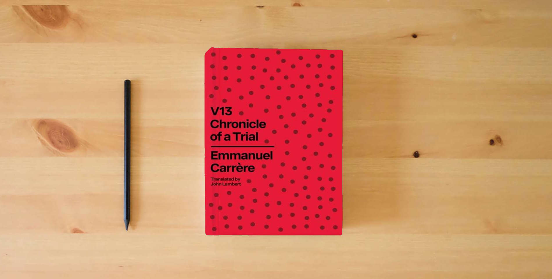 The book V13: Chronicle of a Trial is on the table