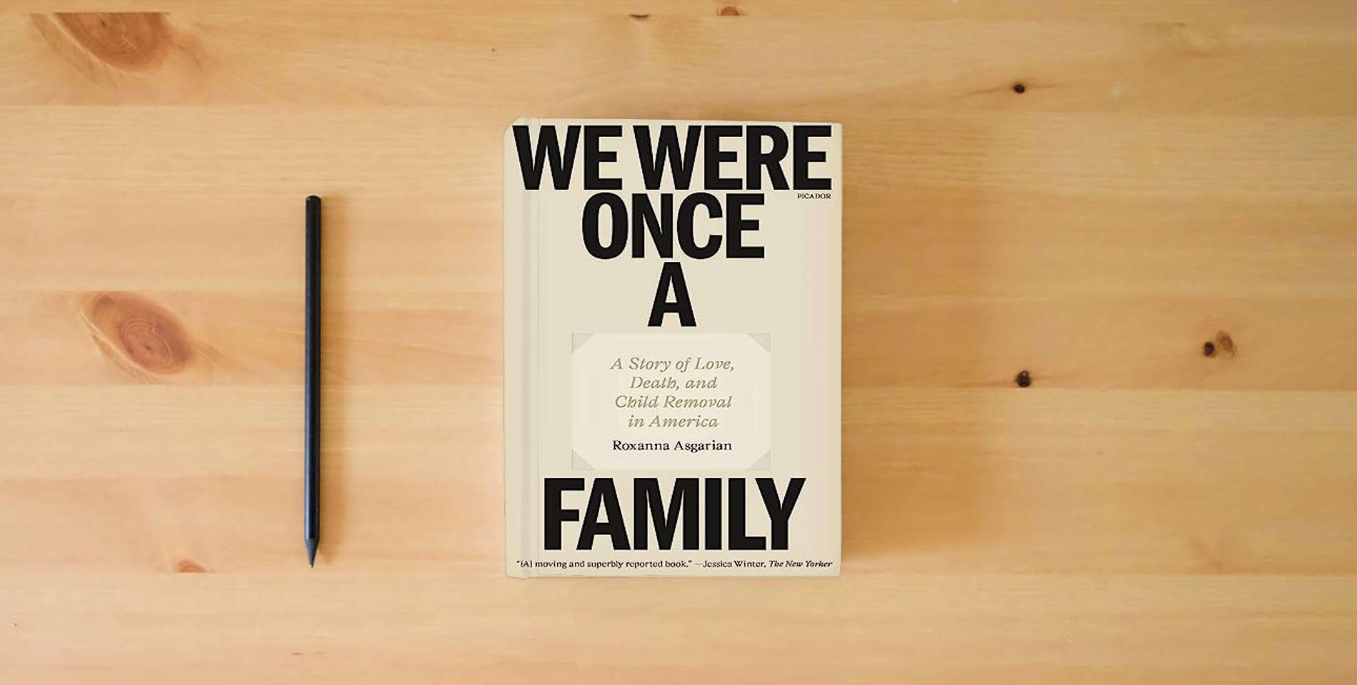 The book We Were Once a Family: A Story of Love, Death, and Child Removal in America is on the table