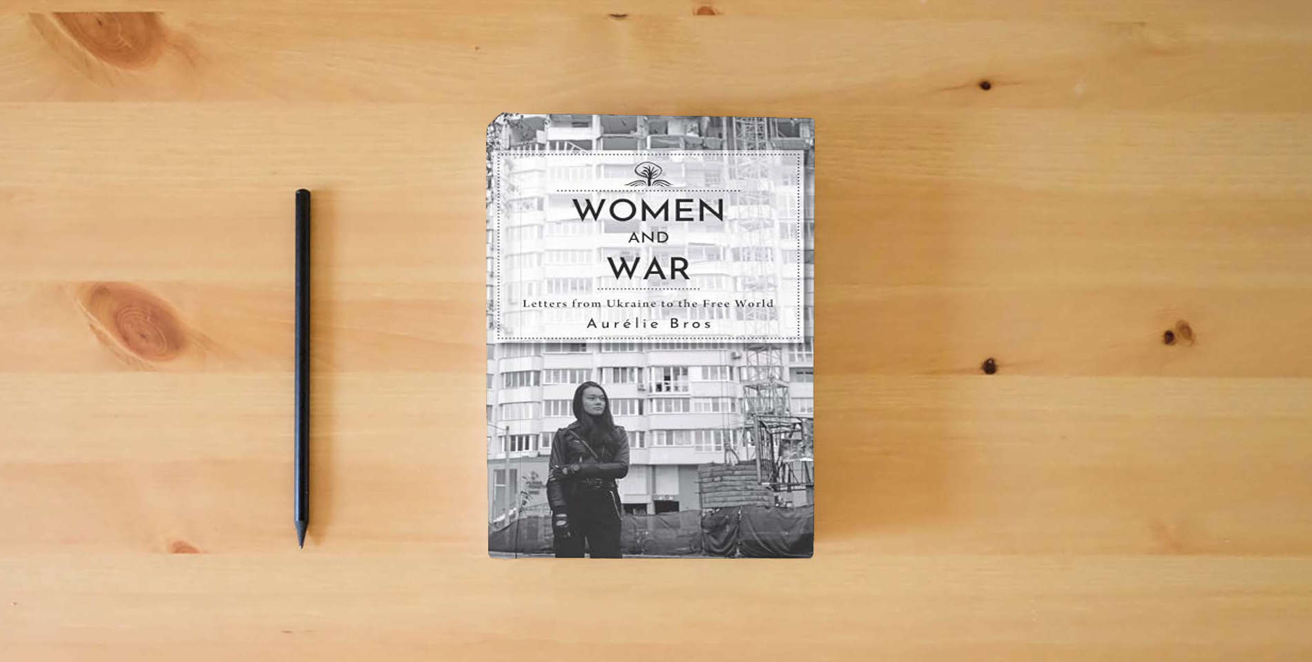 The book Women and War (English Edition): Letters from Ukraine to the Free World (Cherry Orchard Books) is on the table