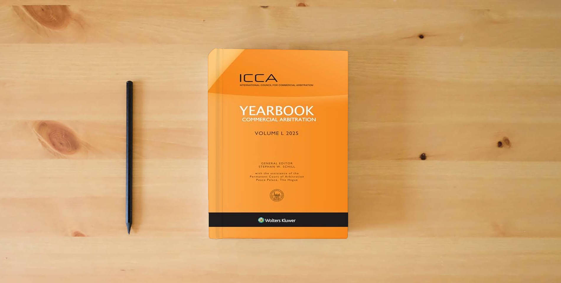 The book Yearbook Commercial Arbitration, Volume L (2025) is on the table