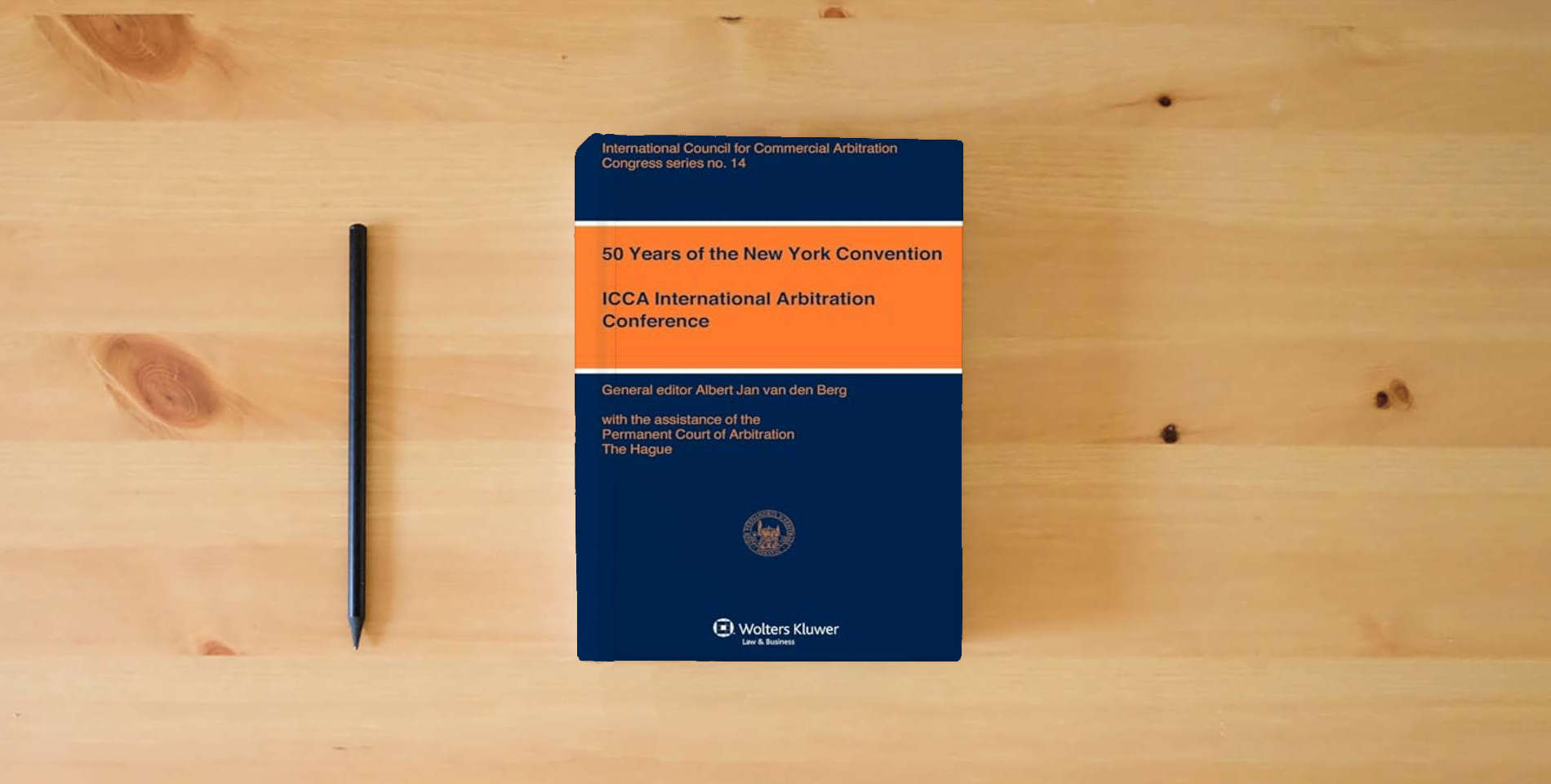 The book 50 Years of the New York Convention (ICCA Congress Series) (International Council for Commerical Arbitration Congress) is on the table