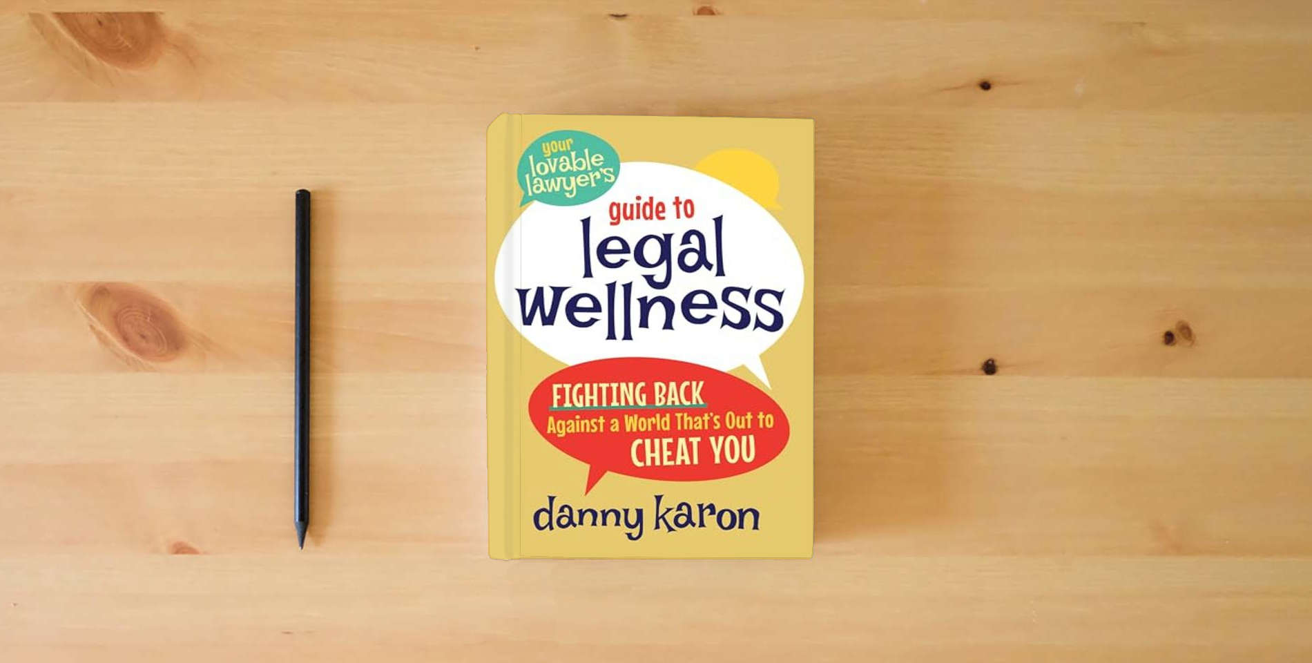 The book Your Lovable Lawyer's Guide to Legal Wellness: Fighting Back Against a World That's Out to Cheat You is on the table