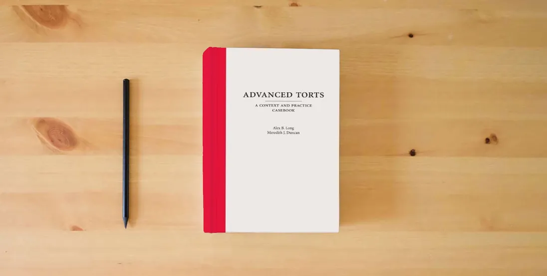 The book Advanced Torts: A Context and Practice Casebook (Context and Practice Series)} is on the table