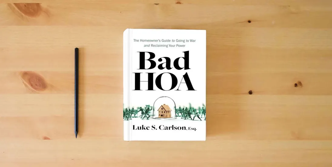 The book Bad HOA: The Homeowner's Guide to Going to War and Reclaiming Your Power} is on the table