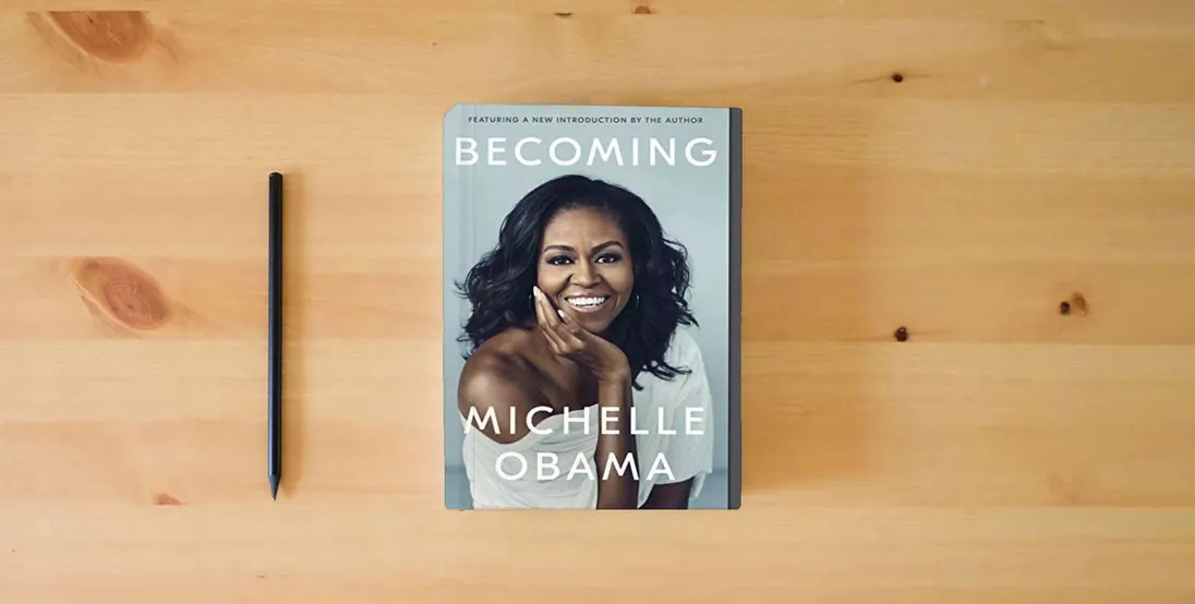 The book Becoming} is on the table