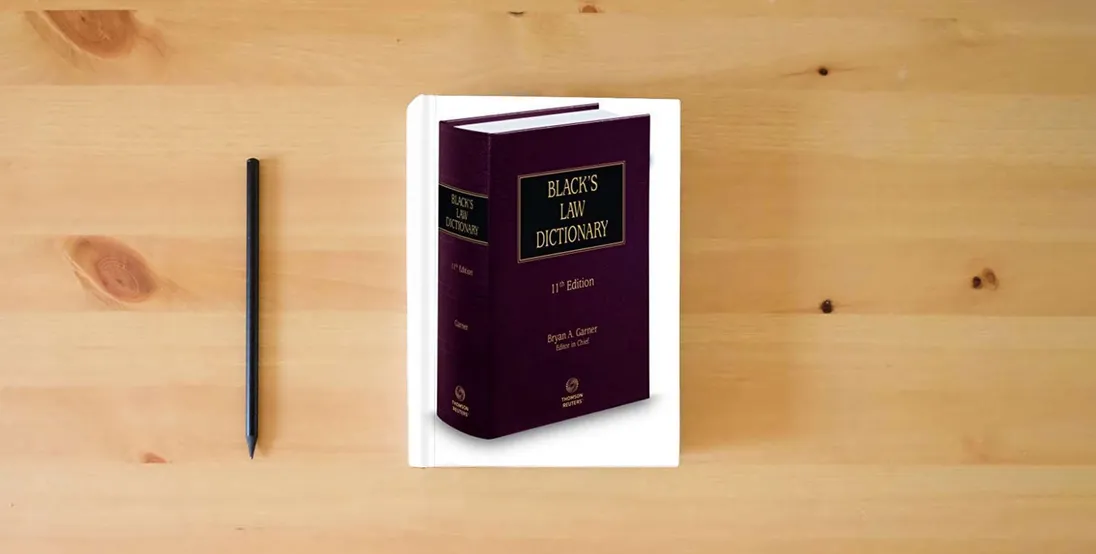 The book Black’s Law Dictionary, 11th Edition (BLACK'S LAW DICTIONARY (STANDARD EDITION))} is on the table