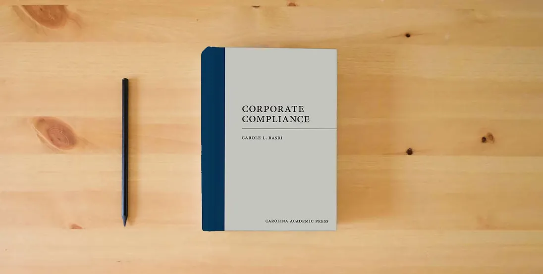 The book Corporate Compliance (Paperback)} is on the table
