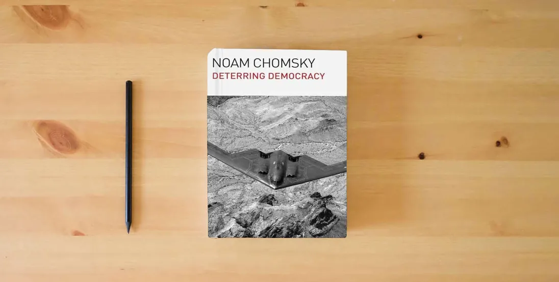 The book Deterring Democracy} is on the table