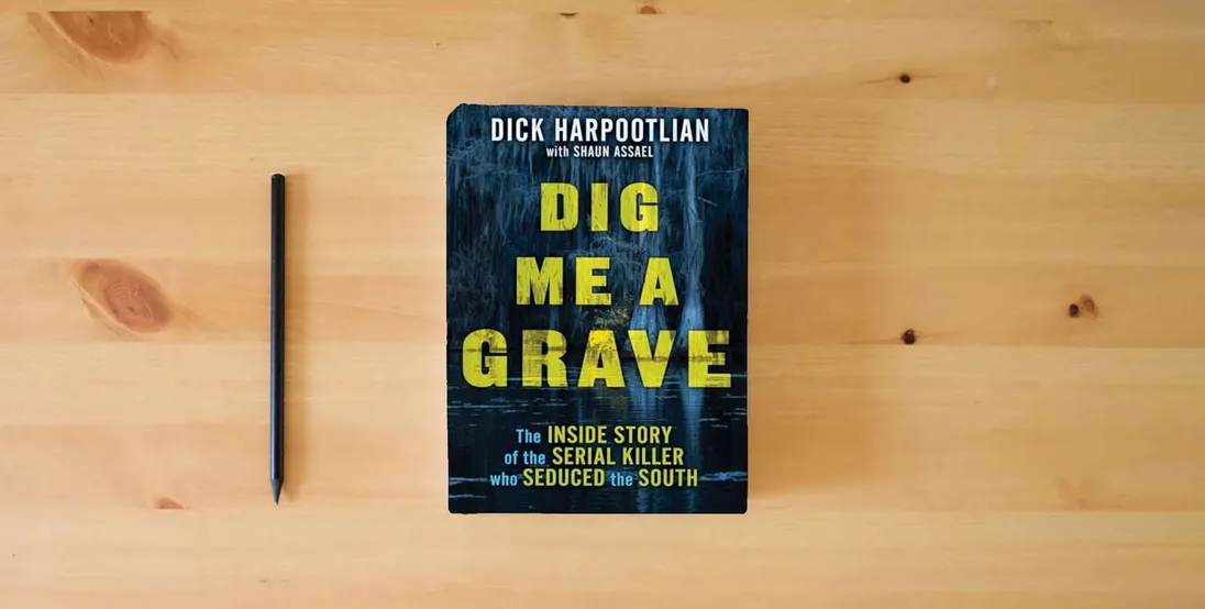 The book Dig Me a Grave: The Inside Story of the Serial Killer Who Seduced the South} is on the table