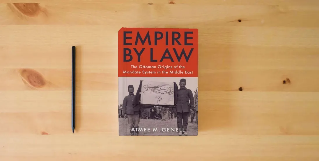 The book Empire by Law: The Ottoman Origins of the Mandate System in the Middle East (Columbia Studies in International and Global History)} is on the table