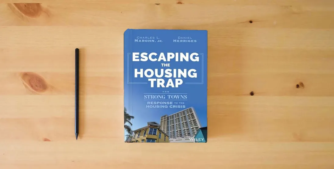 The book Escaping the Housing Trap: The Strong Towns Response to the Housing Crisis} is on the table