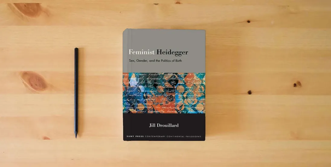 The book Feminist Heidegger: Sex, Gender, and the Politics of Birth (Suny Contemporary Continental Philosophy)} is on the table