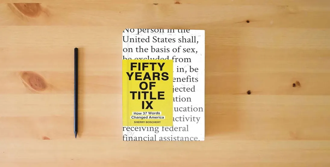 The book Fifty Years of Title IX: How 37 Words Changed America} is on the table