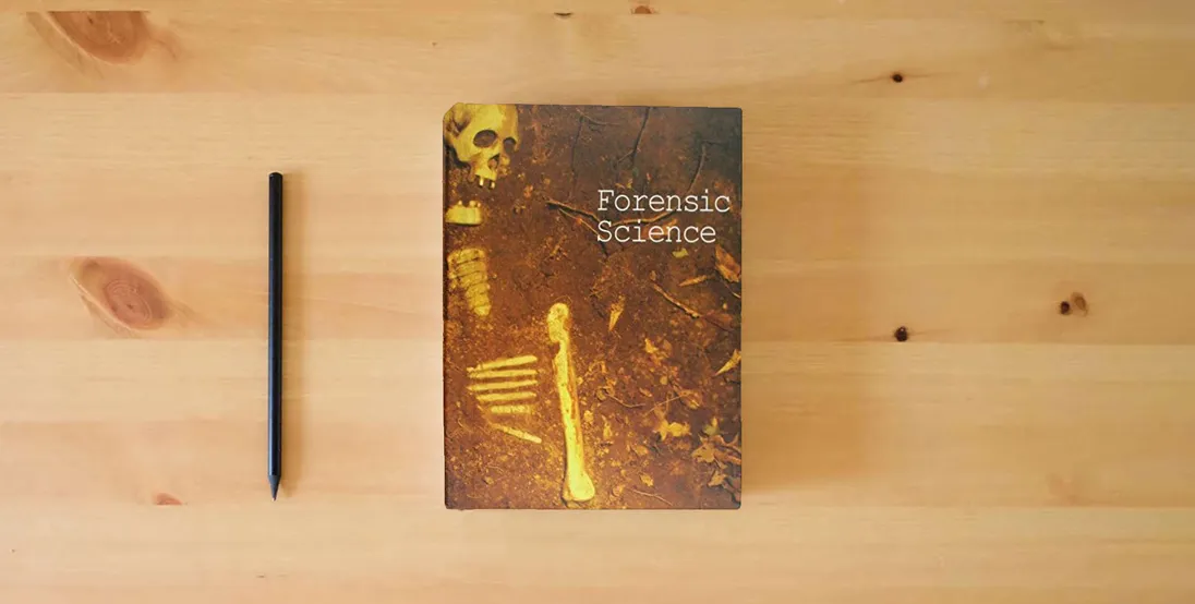 The book Forensic Science (Critical Surveys of Literature)} is on the table