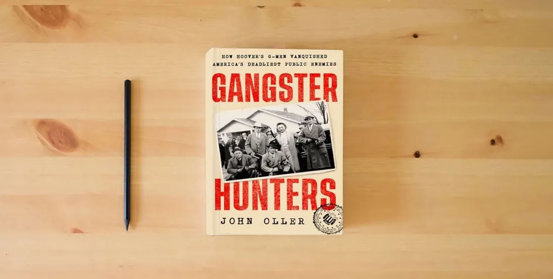 The book Gangster Hunters: How Hoover's G-men Vanquished America's Deadliest Public Enemies} is on the table