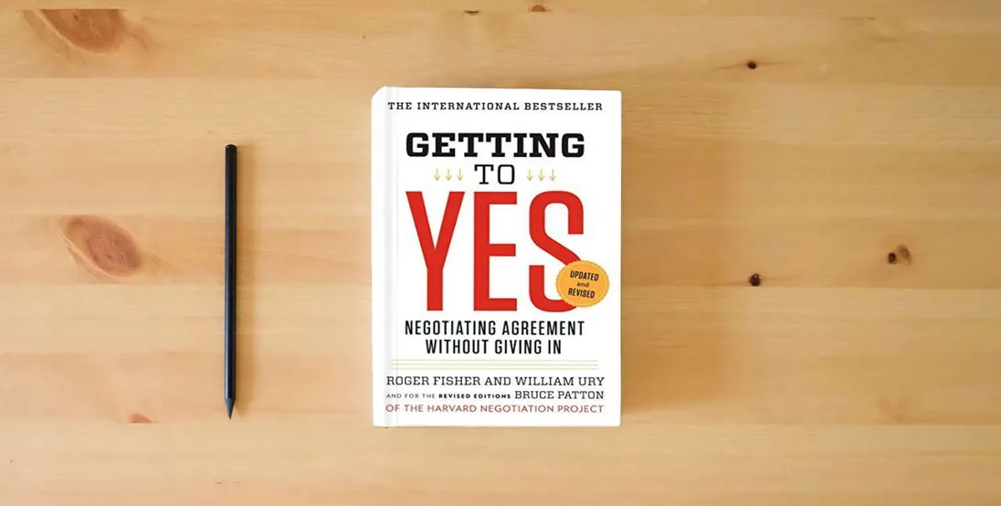The book Getting to Yes: Negotiating Agreement Without Giving In} is on the table