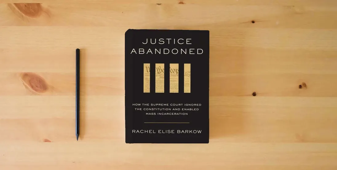 The book Justice Abandoned: How the Supreme Court Ignored the Constitution and Enabled Mass Incarceration} is on the table