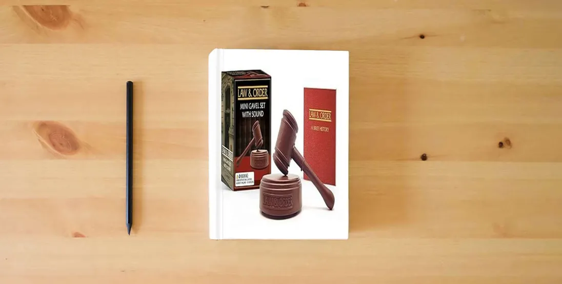 The book Law & Order: Mini Gavel Set with Sound (RP Minis)} is on the table