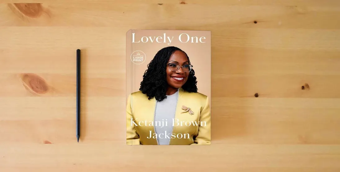 The book Lovely One: A Memoir} is on the table