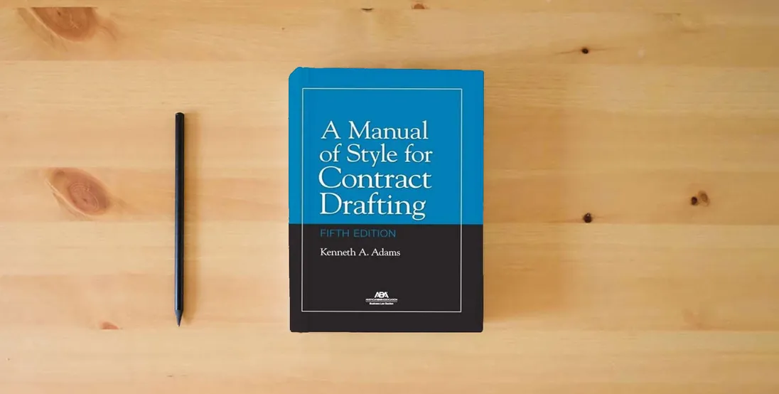 The book A Manual of Style for Contract Drafting, Fifth Edition} is on the table