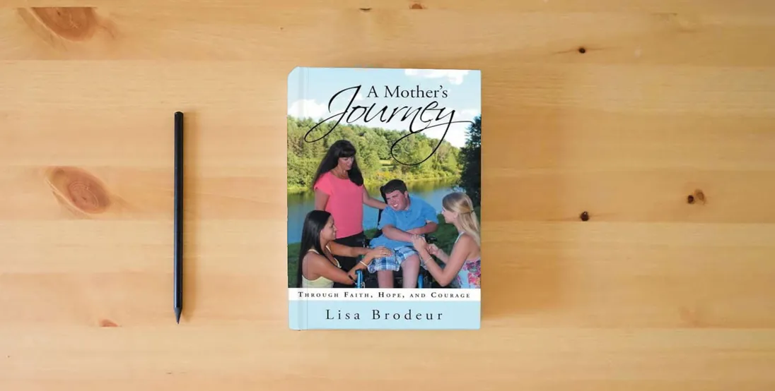 The book A Mother's Journey: Through Faith, Hope, and Courage} is on the table