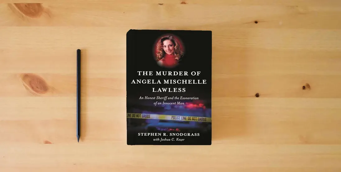 The book Murder of Angela Mischelle Lawless, The: An Honest Sheriff and the Exoneration of an Innocent Man} is on the table
