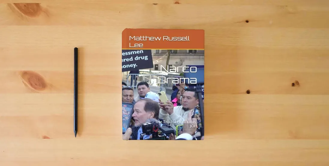 The book Narco Drama: The Trial of Honduras' JOH} is on the table