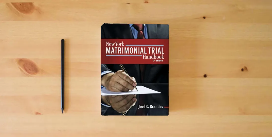 The book New York Matrimonial Trial Handbook 2nd} is on the table