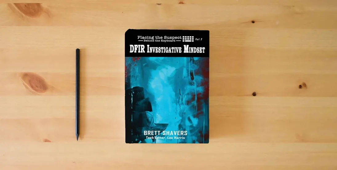 The book Placing the Suspect Behind the Keyboard: DFIR Investigative Mindset} is on the table