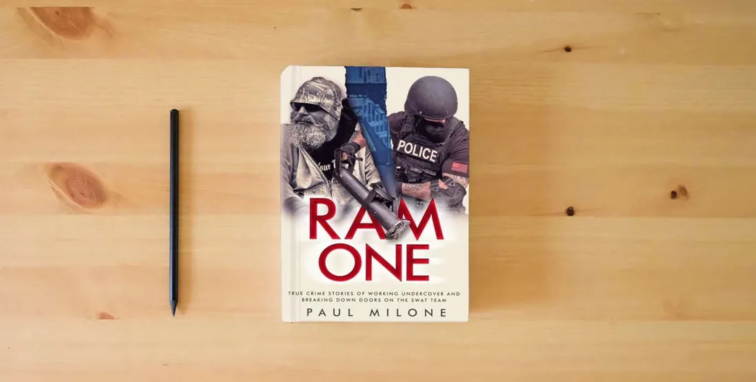 The book Ram One: True Crime Stories of Working Undercover and Breaking Down Doors on the SWAT Team} is on the table