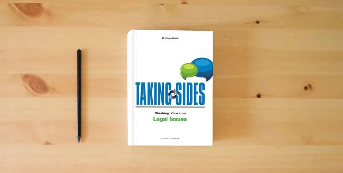 The book Taking Sides: Clashing Views on Legal Issues, 16th Edition} is on the table