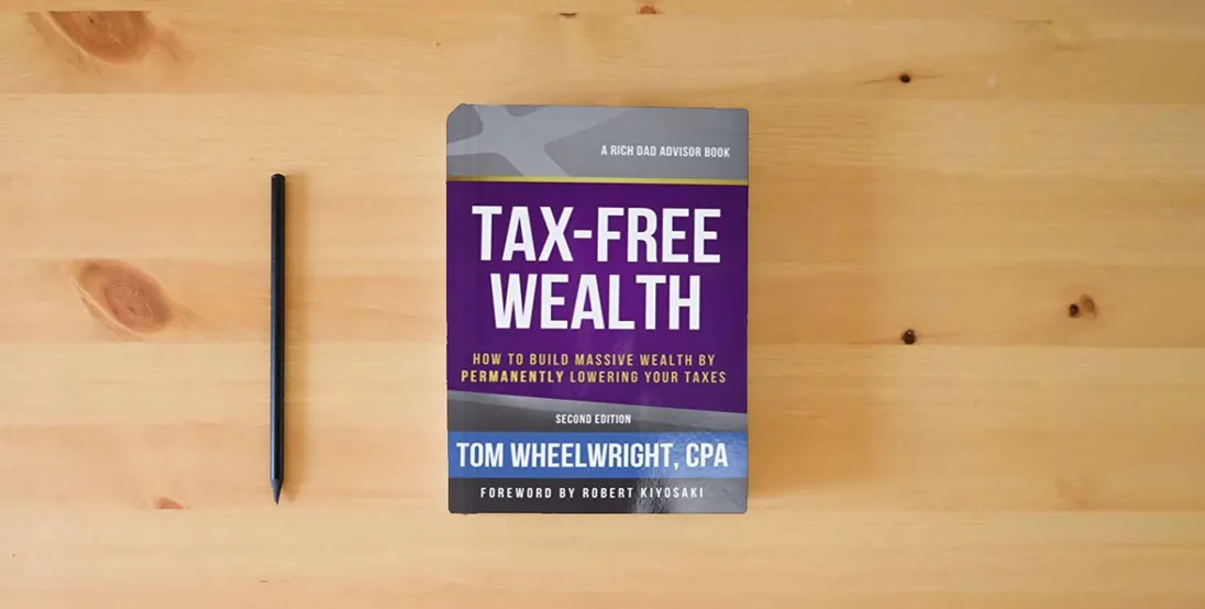The book Tax-Free Wealth: How to Build Massive Wealth by Permanently Lowering Your Taxes (Rich Dad Advisors)} is on the table