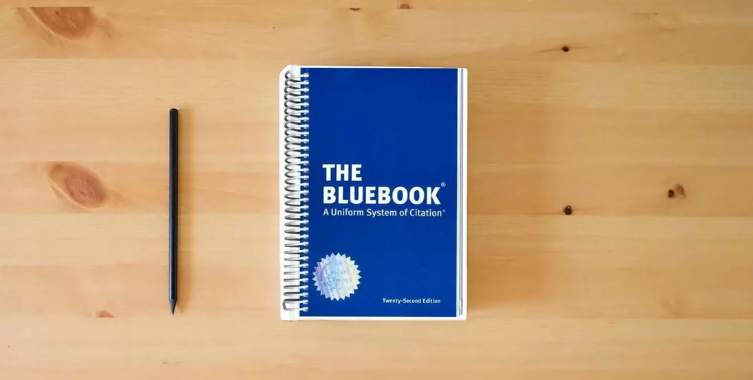 The book The Bluebook: A Uniform System of Citation} is on the table