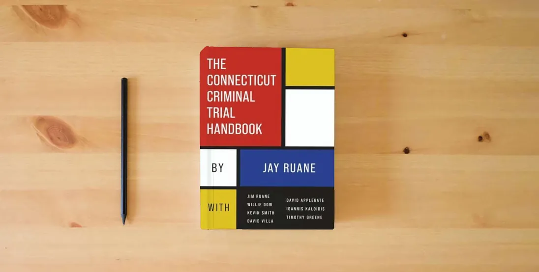 The book The Connecticut Criminal Trial Handbook} is on the table