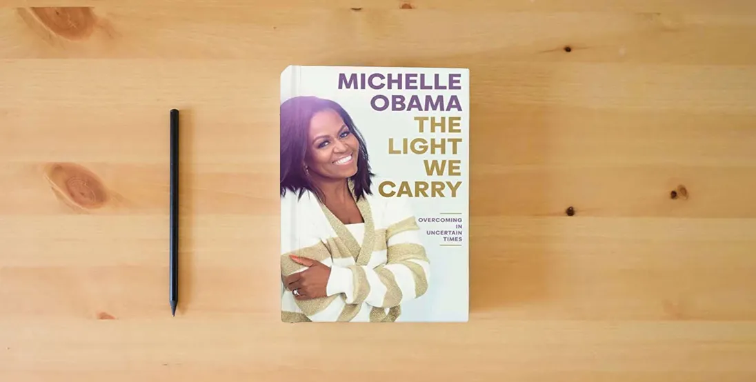 The book The Light We Carry: Overcoming in Uncertain Times} is on the table