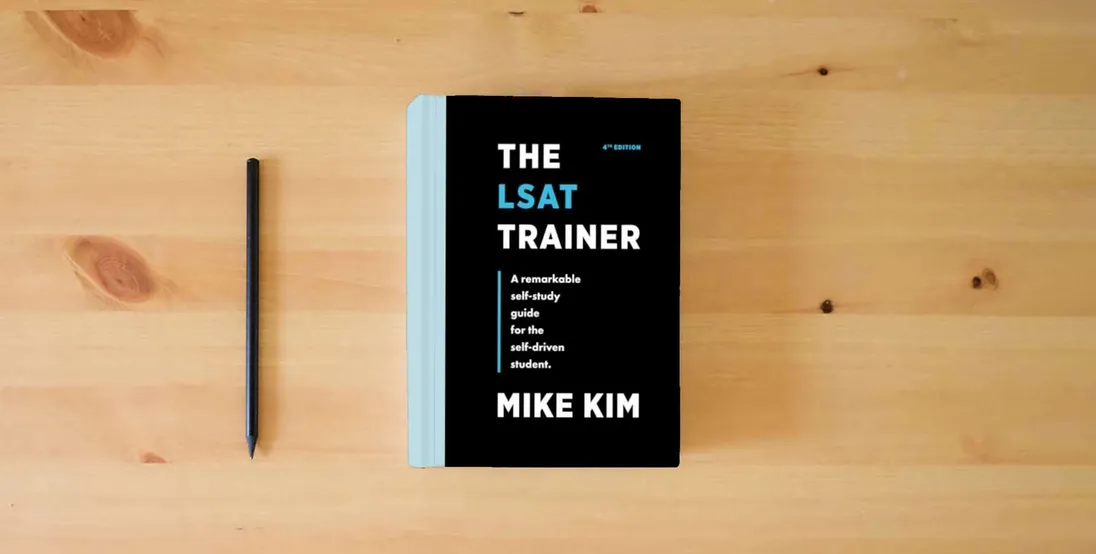 The book The LSAT Trainer: A Remarkable Self-Study Guide For The Self-Driven Student} is on the table