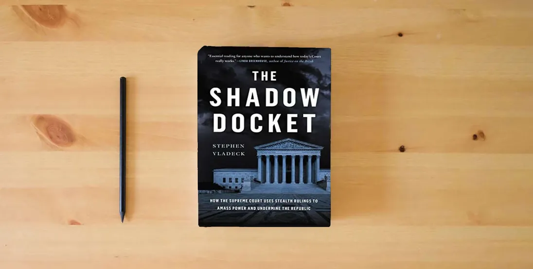The book The Shadow Docket: How the Supreme Court Uses Stealth Rulings to Amass Power and Undermine the Republic} is on the table