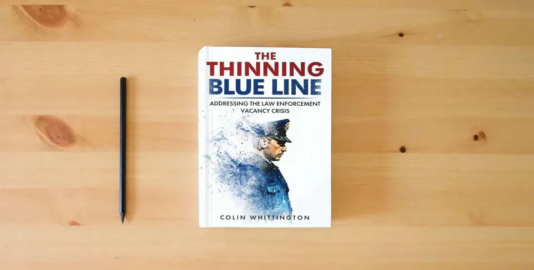 The book The Thinning Blue Line: Addressing the Law Enforcement Vacancy Crisis} is on the table
