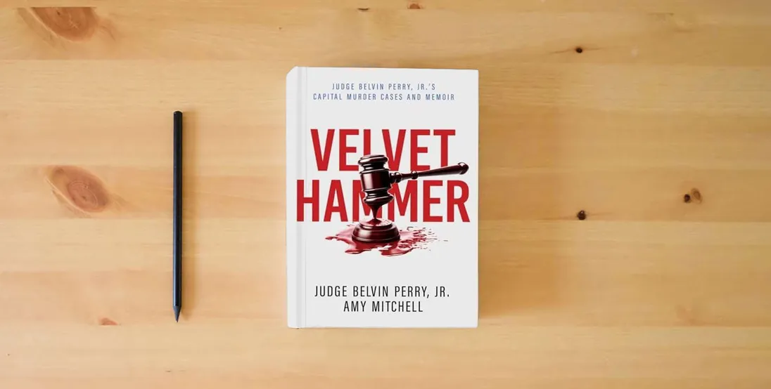 The book The Velvet Hammer: Judge Belvin Perry, Jr.'s Capital Murder Cases and Memoir} is on the table