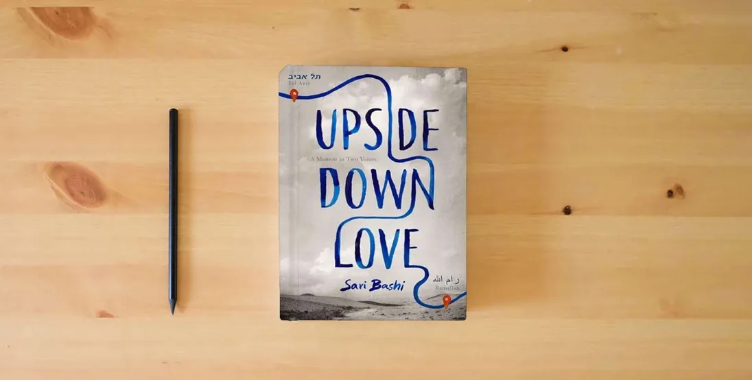 The book Upside-Down Love: A Memoir in Two Voices} is on the table