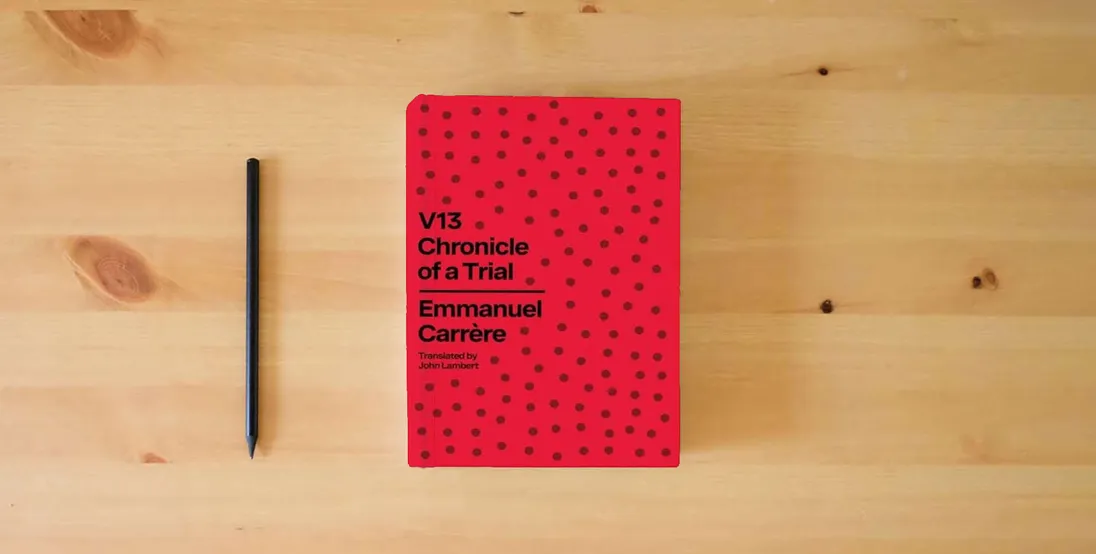 The book V13: Chronicle of a Trial} is on the table