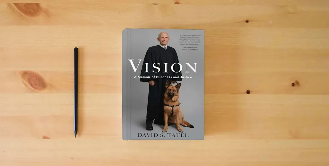 The book Vision: A Memoir of Blindness and Justice} is on the table