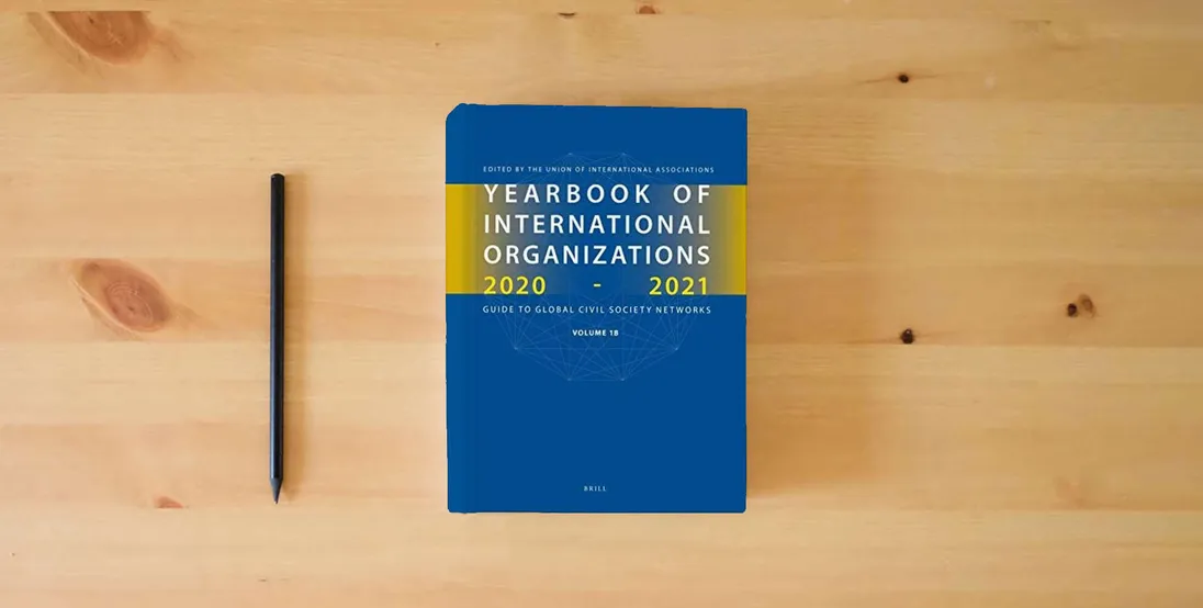 The book Yearbook of International Organizations 2020-2021, Volumes 1A & 1B (SET)} is on the table